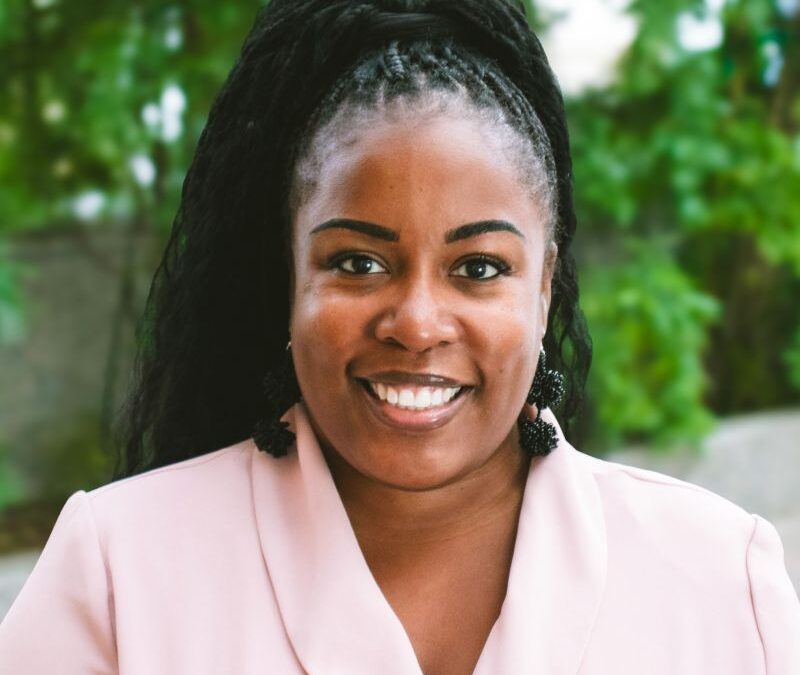 Artrella Cohn happy headshot in downtown Kalamazoo