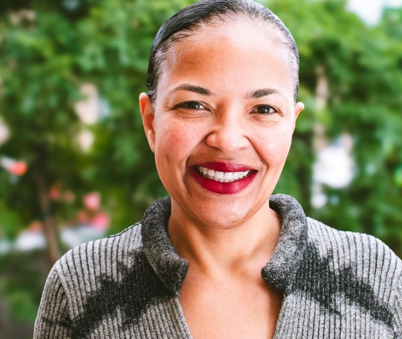 Denise Crawford happy headshot in downtown Kalamazoo