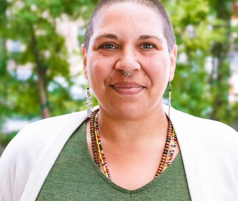 Kama Mitchell happy headshot in downtown Kalamazoo