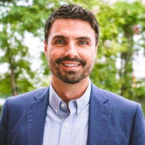 Lucas Mansberger happy headshot in downtown Kalamazoo