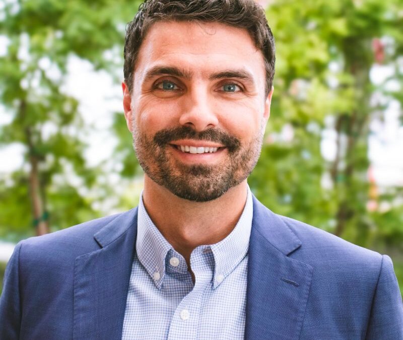 Lucas Mansberger happy headshot in downtown Kalamazoo
