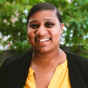 Happy headshot of Jasmine in downtown Kalamazoo