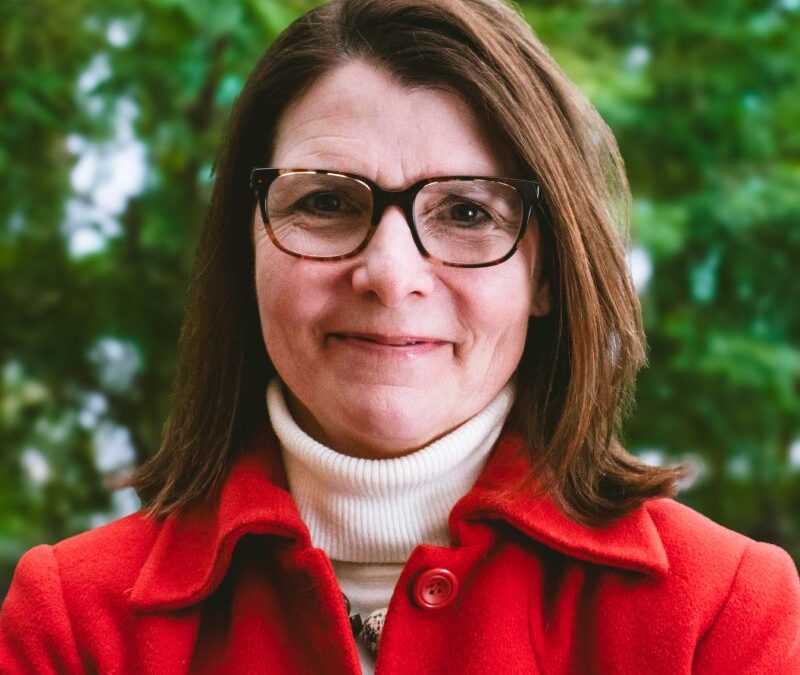 Joanna Donnelly Dales happy headshot in downtown Kalamazoo