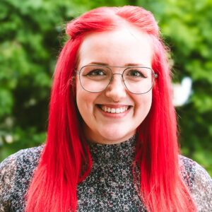 Image of Izzy in front of green background