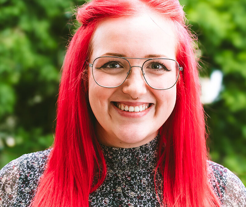 Image of Izzy in front of green background