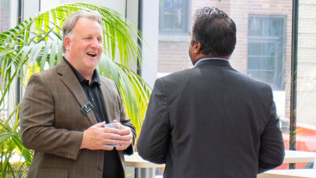 Two individuals engaged in a lively discussion