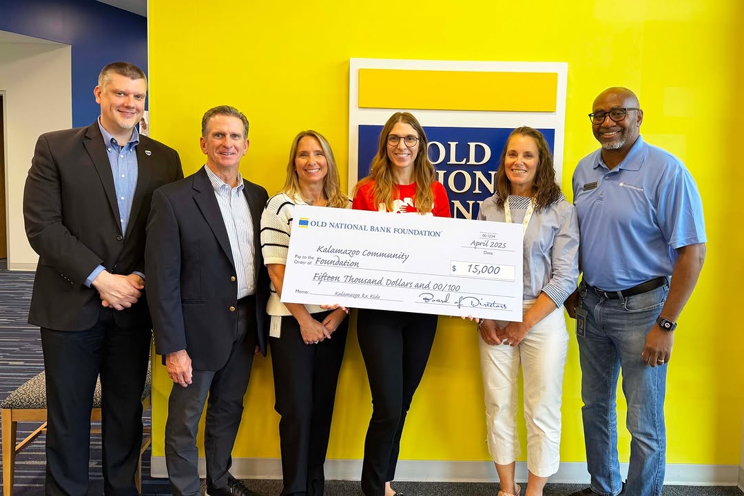 KZCF staff being presented with a gift to our Community Urgent Relief Fund