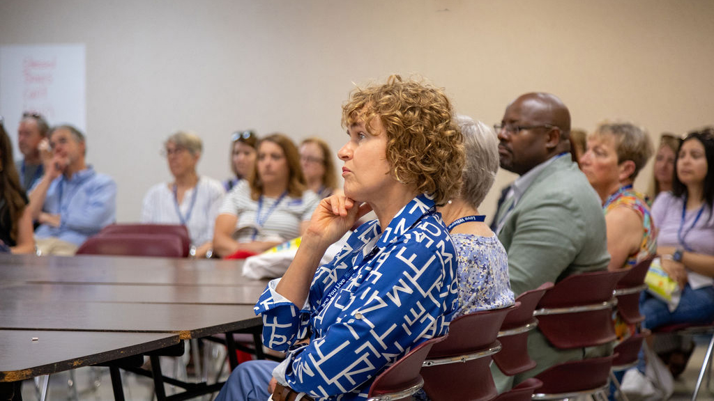 Group of donors actively engaged as they tour a local nonprofit organization